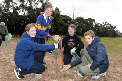 St Patrick's College and Loreto College students plant trees together
