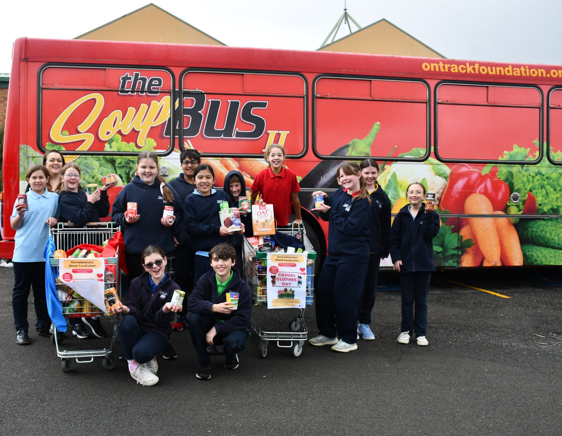 OLHC teacher and Soup Bus volunteer, Angelique Greene, with OLHC students.