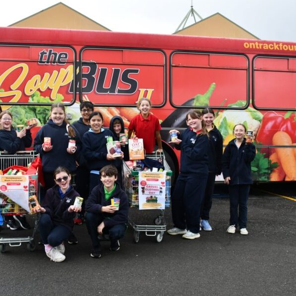 OLHC teacher and Soup Bus volunteer, Angelique Greene, with OLHC students.